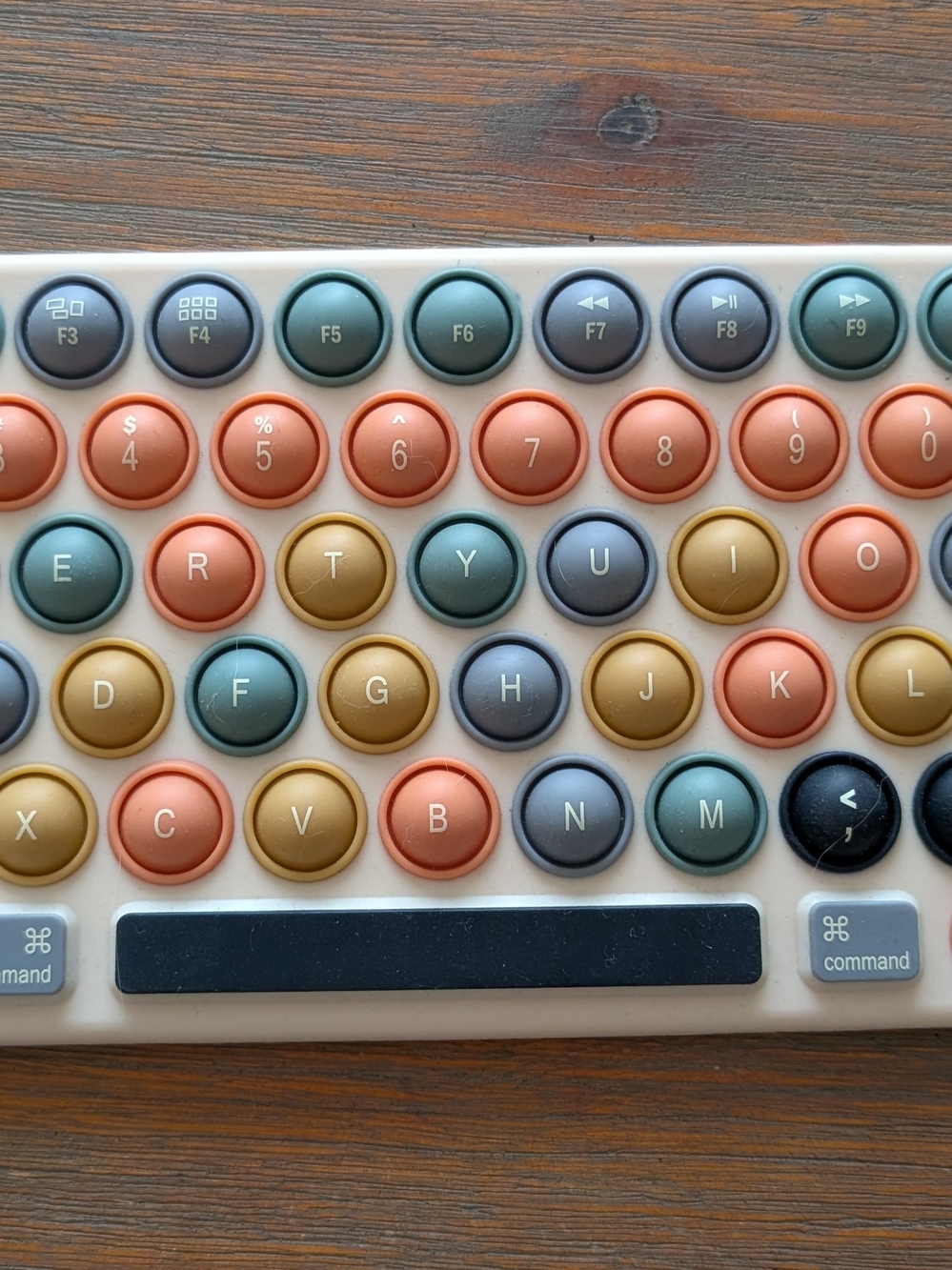 Zara Kids Pop-it Keyboard in Coral, Teal, Gold, Beige.